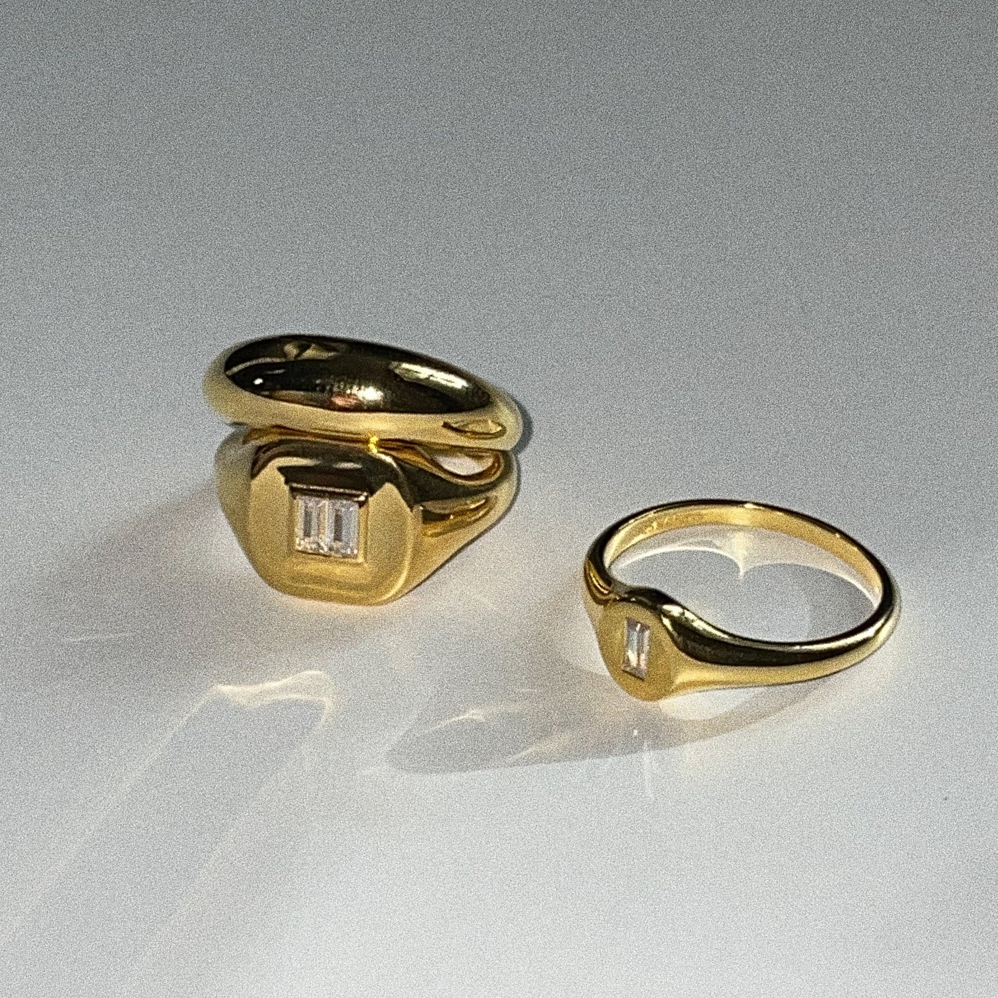The Billy Signet Ring is a perfect in-between of a masculine and feminine look with a bold and exaggerated face. Subtly embellished with two baguette zircon stones.